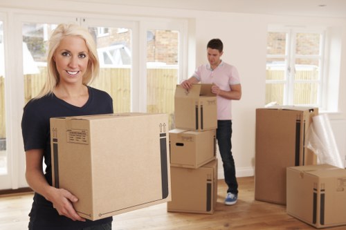 Moving van and packed boxes for local removals in Upperclapton