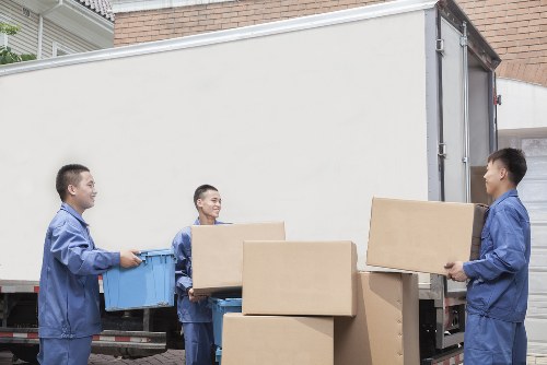Professional movers handling furniture during an Upperclapton house move
